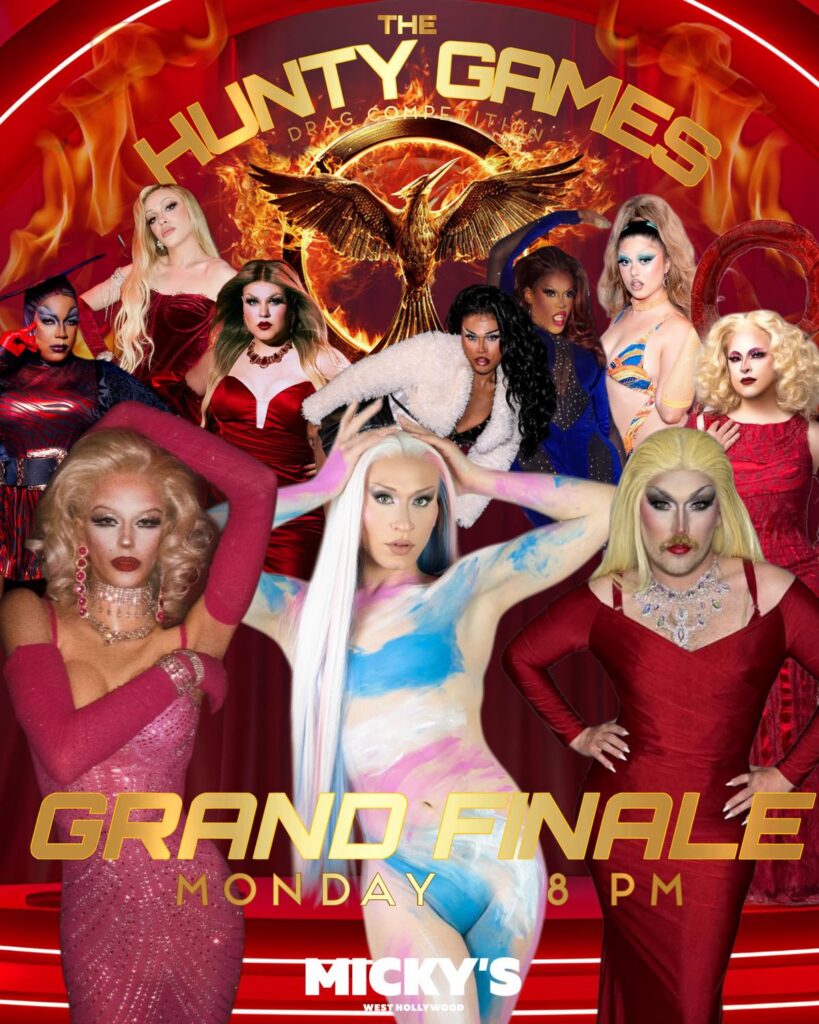 Promotional poster for The Hunty Games Drag Competition Grand Finale at Micky’s West Hollywood. The design features a fiery red background with a golden phoenix emblem and multiple drag performers in glamorous red and colorful outfits. Large gold text reads 'Grand Finale Monday 8 PM' with Micky’s West Hollywood branding at the bottom.
